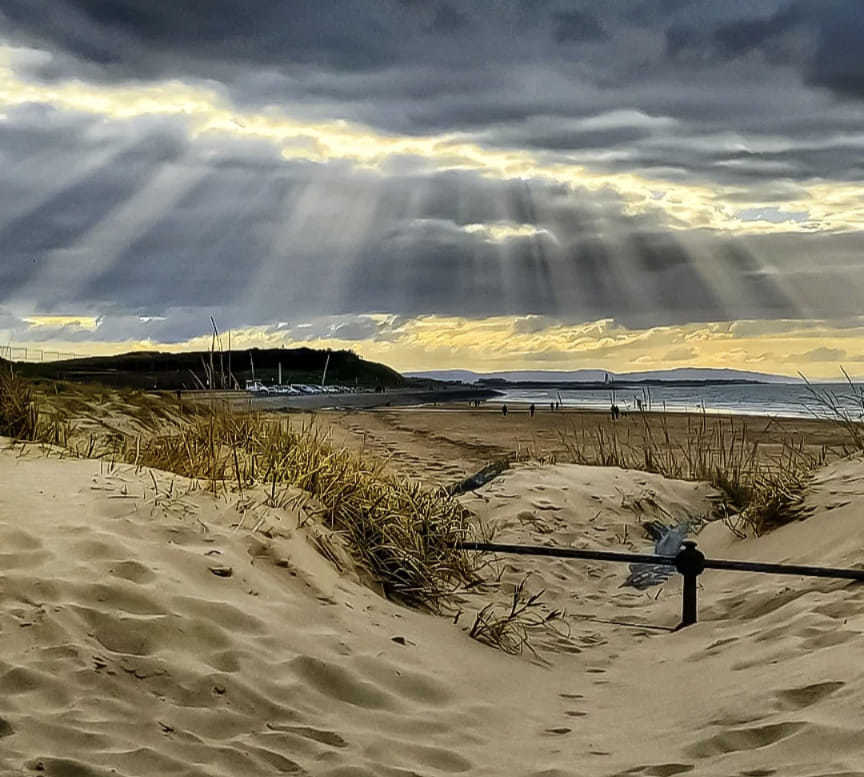 Light from above at Wallasey beach by Kimberley Phillips