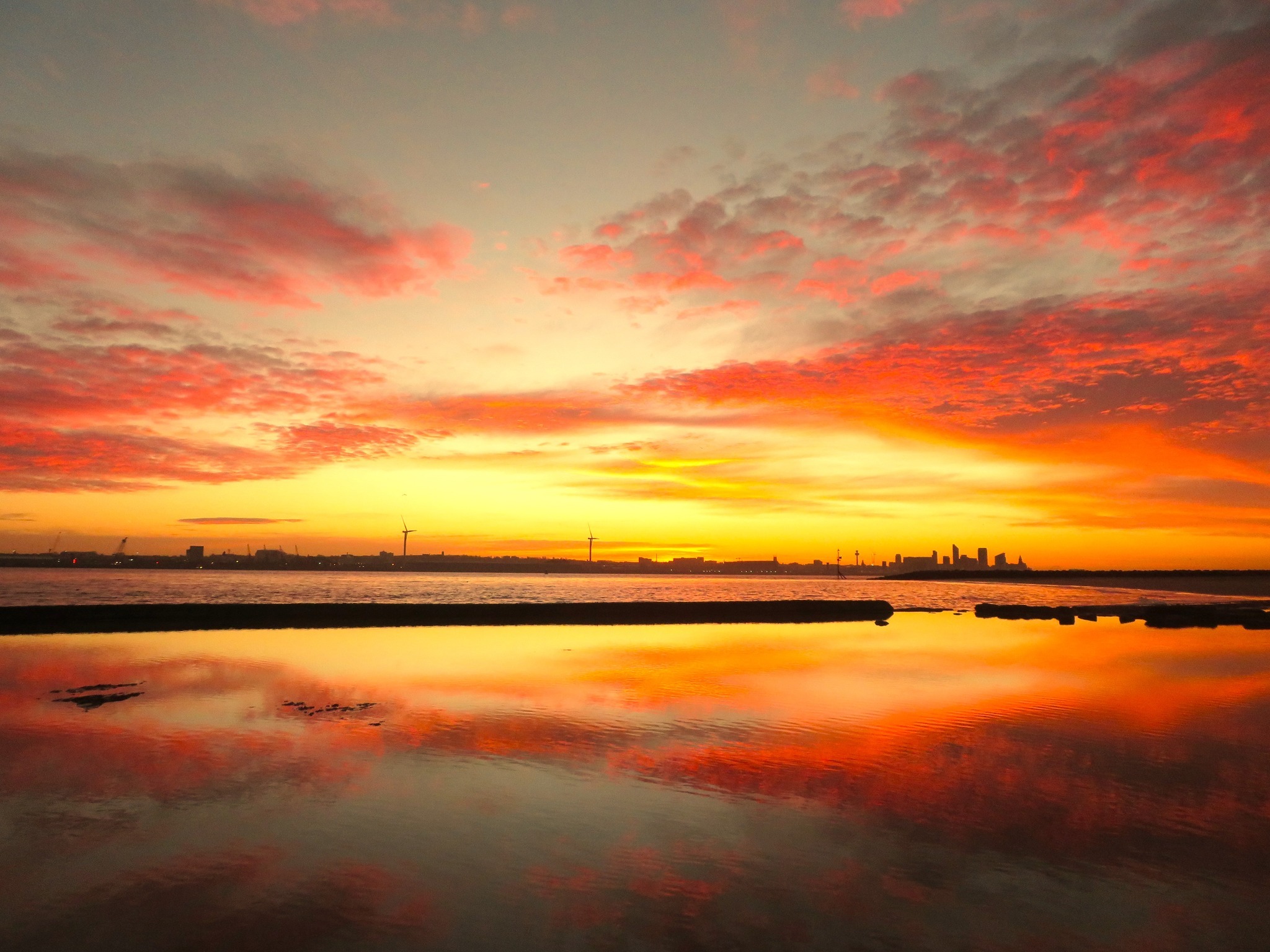 Sunrise over the Mersey by Jan E Peddie