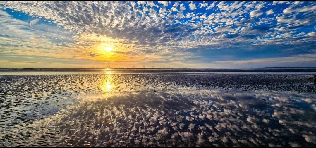 Mackerel clouds reflecting on the water at Leasowe bay