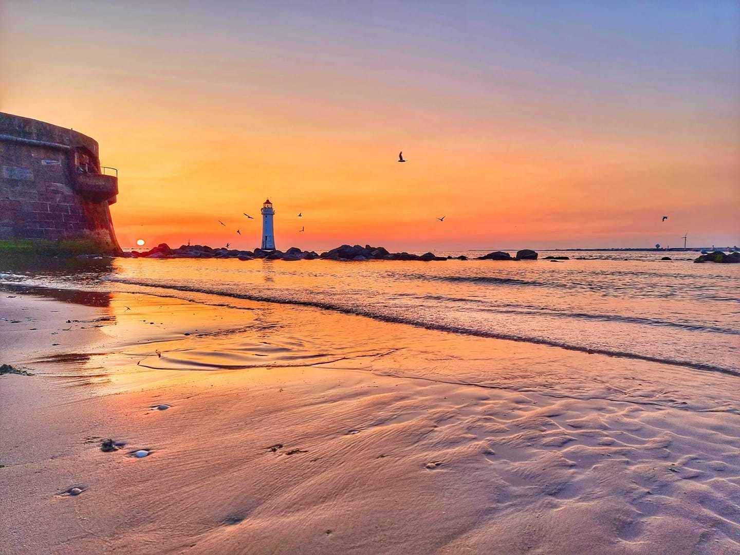 Summer skies over the lighthouse by Gary Beale